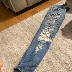 Carnage Jeans with floral design behind knee